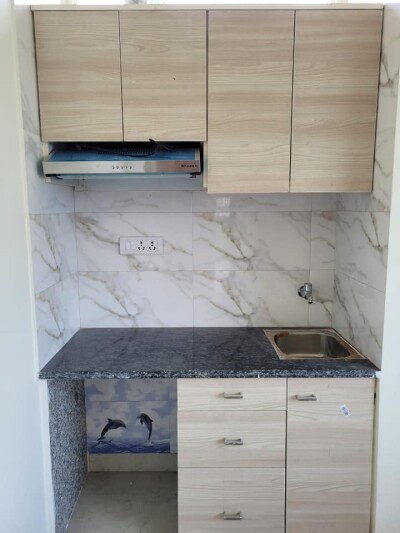 1RK fully furnished with double bed with mattress, almirah, kitchen chimney, chair and table.
